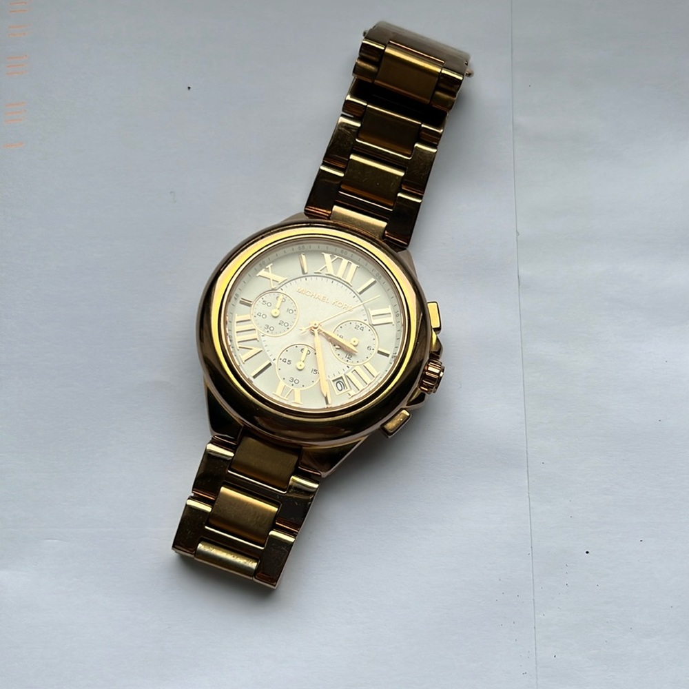 Michael Kors rose gold watch, extra shackles and user guide included.